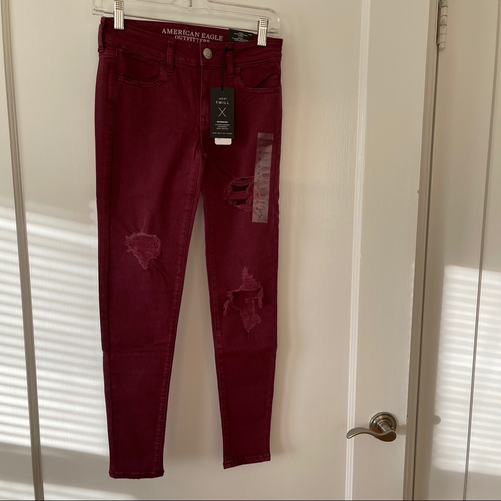 American Eagle BNWT maroon distressed jeans